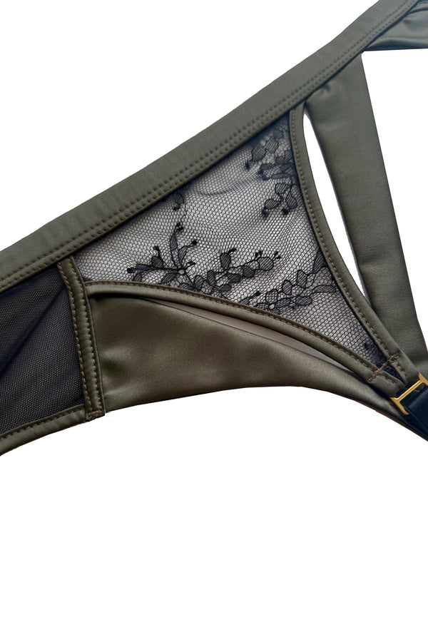 Iona peep bra in black Chantilly with moss green satin trim – designer lingerie by Tatu Couture