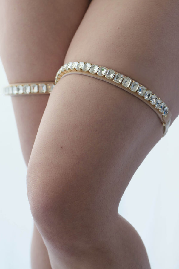Tatu Couture X Ludovica Martire Luxury Bridal Crystal thigh garters in clear sparkling crystal swarovski onto Oyster Blush leather