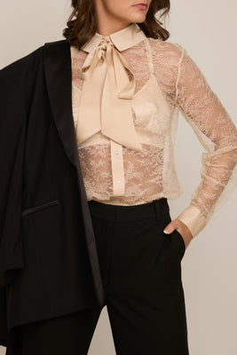 Celeste French lace thong bodysuit styled as underwear as outerwear with detachable silk bow and tailored trousers