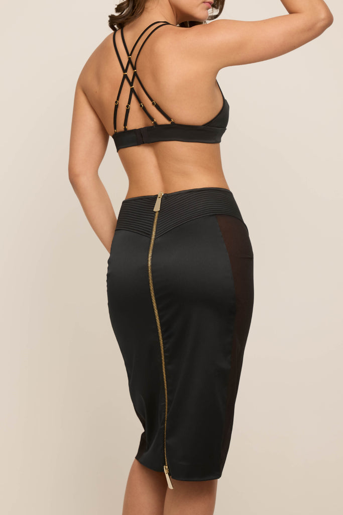 Back view of Gia Zip Skirt showing full-length gold zip and quilted waistband, British-made luxury satin pencil skirt