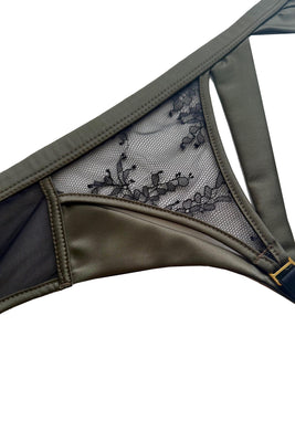 Iona peep bra in black Chantilly with moss green satin trim – designer lingerie by Tatu Couture 