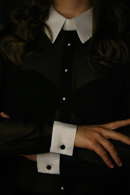 Designer black silk blouse bodysuit with white collar and cuffs 