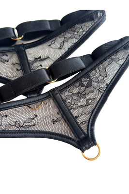 High-end sheer lace leg garters featuring black sheer lace and satin binding accents, designed to enhance and complement the Sylvia range with couture elegance.