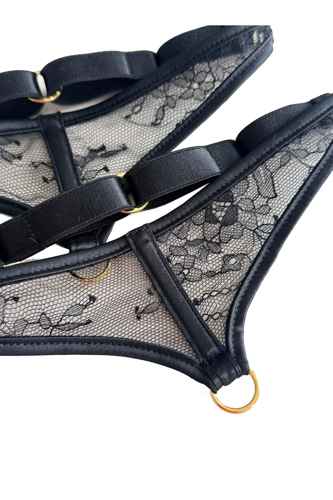 High-end sheer lace leg garters featuring black sheer lace and satin binding accents, designed to enhance and complement the Sylvia range with couture elegance.
