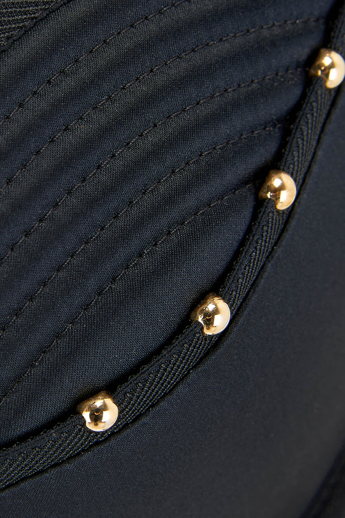 Close up details of gold studding on the Babooshka suspender thong