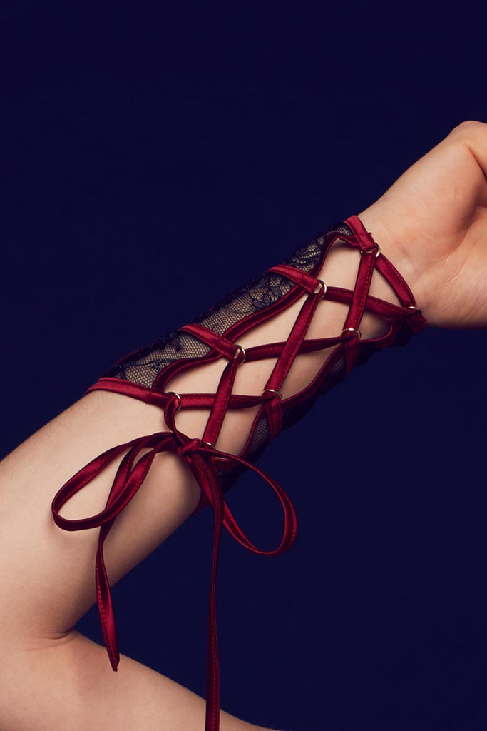 Red satin wrist ties on inside of Odette luxury sheer lace cuffs by Tatu Couture